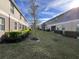 A well-manicured lawn shared by adjacent properties under a bright, sunny sky at 15198 Harrington Cove Dr, Orlando, FL 32824