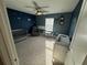 Charming room featuring blue walls with star accents and a crib at 15198 Harrington Cove Dr, Orlando, FL 32824