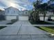 Inviting townhome with well-maintained landscaping and a large driveway at 15198 Harrington Cove Dr, Orlando, FL 32824