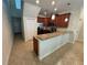 Charming kitchen with modern appliances, breakfast bar and tile flooring at 15198 Harrington Cove Dr, Orlando, FL 32824