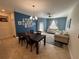 Inviting living room with natural light and a dining area for entertaining at 15198 Harrington Cove Dr, Orlando, FL 32824