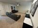 Spacious upper level living room with comfortable seating, entertainment center and lots of light at 15198 Harrington Cove Dr, Orlando, FL 32824