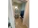 Cozy powder room featuring a pedestal sink, toilet, and a round mirror at 15198 Harrington Cove Dr, Orlando, FL 32824