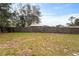 Wooden privacy fence with a large grassy backyard provides a sense of seclusion at 1600 Amboy Dr, Deltona, FL 32738