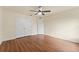 Bright bedroom featuring hardwood floors, a ceiling fan, and a large closet at 1600 Amboy Dr, Deltona, FL 32738