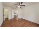 Spacious bedroom featuring wood-look floors, a ceiling fan, and an adjacent flex space at 1600 Amboy Dr, Deltona, FL 32738