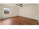 Bright bedroom featuring a ceiling fan and a large window for ample natural light at 1600 Amboy Dr, Deltona, FL 32738