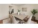 This dining room offers seating for six, a large window, and is ideal for Gathering meals and entertaining at 1600 Amboy Dr, Deltona, FL 32738