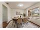 Dining room featuring a modern table with seating for six and natural light at 1600 Amboy Dr, Deltona, FL 32738