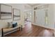 Welcoming foyer with wood flooring, a bench, and a front door with sidelights at 1600 Amboy Dr, Deltona, FL 32738