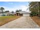 Beautiful brick single Gathering home with a spacious driveway and attached garage at 1600 Amboy Dr, Deltona, FL 32738