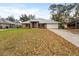 Well-kept brick single Gathering home with a green lawn and attached garage at 1600 Amboy Dr, Deltona, FL 32738
