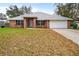 Charming single-story brick home with well-maintained lawn and attached garage at 1600 Amboy Dr, Deltona, FL 32738