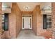 Covered front porch with brick columns, providing a welcoming entrance to the home at 1600 Amboy Dr, Deltona, FL 32738