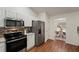 Bright kitchen features stainless steel appliances, granite countertops, and tile backsplash at 1600 Amboy Dr, Deltona, FL 32738