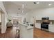 Open concept kitchen with stainless steel appliances, granite countertops, and eat-in bar at 1600 Amboy Dr, Deltona, FL 32738