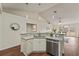 Open-concept kitchen featuring granite counters, stainless steel dishwasher, and modern pendant lighting at 1600 Amboy Dr, Deltona, FL 32738
