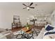 Open-concept living room flowing into the kitchen with stylish decor and hardwood floors at 1600 Amboy Dr, Deltona, FL 32738