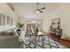 Comfortable living room with modern decor, ceiling fan, and sliding door access to the backyard at 1600 Amboy Dr, Deltona, FL 32738