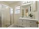 The main bathroom offers a walk-in shower, ample lighting, and a modern vanity at 1600 Amboy Dr, Deltona, FL 32738