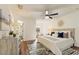The main bedroom features a ceiling fan, ensuite bath, and lots of natural light at 1600 Amboy Dr, Deltona, FL 32738