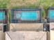 Aerial view of the backyard featuring a screened-in pool and tile roof at 1602 Lima Ave, Kissimmee, FL 34747