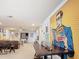Basement area with full wall mural, and secondary game and seating area with direct access to upstairs at 1602 Lima Ave, Kissimmee, FL 34747