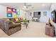 Large, finished basement with unique comic décor, lounge area, and a built in bar area for entertaining at 1602 Lima Ave, Kissimmee, FL 34747