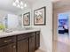 Stylish bathroom with dual sink vanity and granite counters at 1602 Lima Ave, Kissimmee, FL 34747