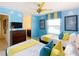 Bright bedroom featuring twin beds and blue cloud accents at 1602 Lima Ave, Kissimmee, FL 34747