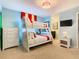 Charming bedroom features bunk beds and light blue walls at 1602 Lima Ave, Kissimmee, FL 34747