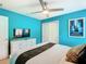 Modern bedroom with a TV, closet and stylish decor at 1602 Lima Ave, Kissimmee, FL 34747