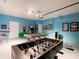 A game room with a foosball table and pool table offers hours of fun and entertainment at 1602 Lima Ave, Kissimmee, FL 34747