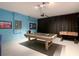 A game room with a pool table and foosball offers hours of fun and entertainment at 1602 Lima Ave, Kissimmee, FL 34747