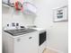 A well-lit laundry room with modern appliances makes laundry chores efficient and easy at 1602 Lima Ave, Kissimmee, FL 34747