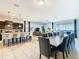 Open concept living room and kitchen area offering spacious design and sliding glass doors to backyard pool at 1602 Lima Ave, Kissimmee, FL 34747
