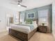A king bed with an ensuite bathroom featuring a bathtub and shower offers comfort and convenience at 1602 Lima Ave, Kissimmee, FL 34747