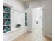 The well-appointed mud room with built-in storage and nearby laundry offers practical functionality at 1602 Lima Ave, Kissimmee, FL 34747