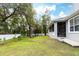 Lush backyard features green grass, mature trees, and a serene outdoor space at 1621 Crescent Rd, Longwood, FL 32750