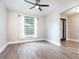 Bright bedroom with a large window, wood flooring, and a ceiling fan at 1621 Crescent Rd, Longwood, FL 32750