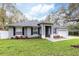 Beautifully landscaped single-story home with a two-car garage and inviting entrance at 1621 Crescent Rd, Longwood, FL 32750
