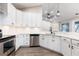 Well-equipped kitchen featuring modern stainless steel appliances and ample counter space at 1621 Crescent Rd, Longwood, FL 32750
