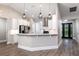 Modern kitchen with white cabinets, stainless steel appliances, and quartz countertops at 1621 Crescent Rd, Longwood, FL 32750