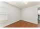 Empty bedroom with wood floors and view of window at 16224 Magnolia Hill St, Clermont, FL 34714