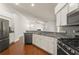 Spacious kitchen features granite countertops, modern stainless steel appliances, and ample cabinet space at 16224 Magnolia Hill St, Clermont, FL 34714