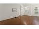 Bright living room featuring hardwood floors, white walls, natural light and open concept design at 16224 Magnolia Hill St, Clermont, FL 34714