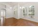 Bright living room featuring hardwood floors, white walls, natural light and open concept design at 16224 Magnolia Hill St, Clermont, FL 34714