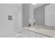 Clean bathroom featuring a modern vanity, bright lighting and a tub-shower combo at 16828 Sanctuary Dr, Winter Garden, FL 34787