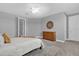 Bright bedroom with a dresser offering a comfortable and airy environment at 16828 Sanctuary Dr, Winter Garden, FL 34787
