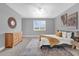 Cozy bedroom with neutral tones, a bright window, and comfortable furnishings creating a serene atmosphere at 16828 Sanctuary Dr, Winter Garden, FL 34787